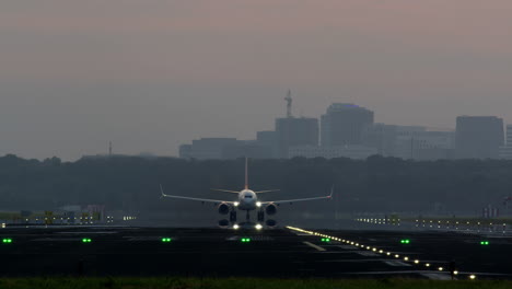 airplane taking off and landing at sunset