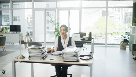 businesswoman overwhelmed with paperwork in a modern office