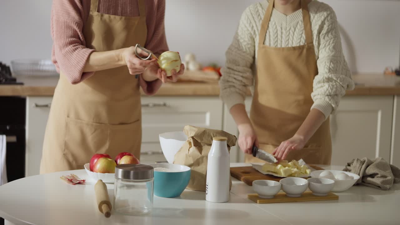 Two Women Preparing Apple Pie in Kitchen
