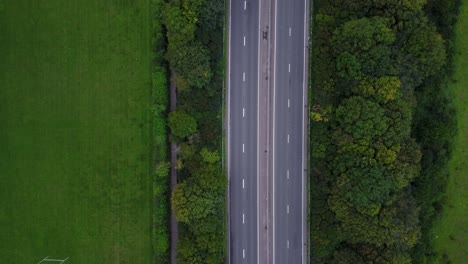 bird's eye view drone shot of motorway in countryside