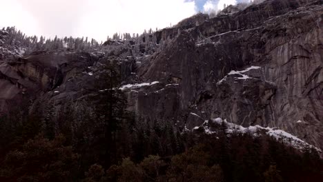 slow rotating shot, looking up at the sheer granite cliff faces on the mist trail in yosemite national park, california