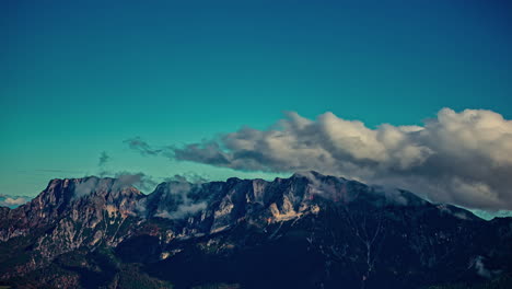 cumulus clouds flowing over austrian alps, time lapse view