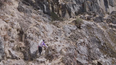 drone shot of tourist trekking through three pass route to everest base camp. rugged landscape, high-altitude trail, and adventure tourism in nepal with peace sensation