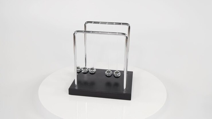 Demonstrates momentum and energy transfer principles