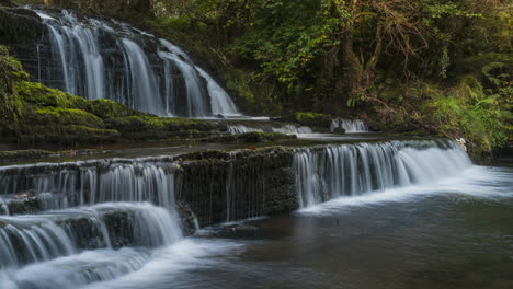 Time-lapse-of-forest-waterfall-in-rural-landscape-during-autumn-in-Ireland