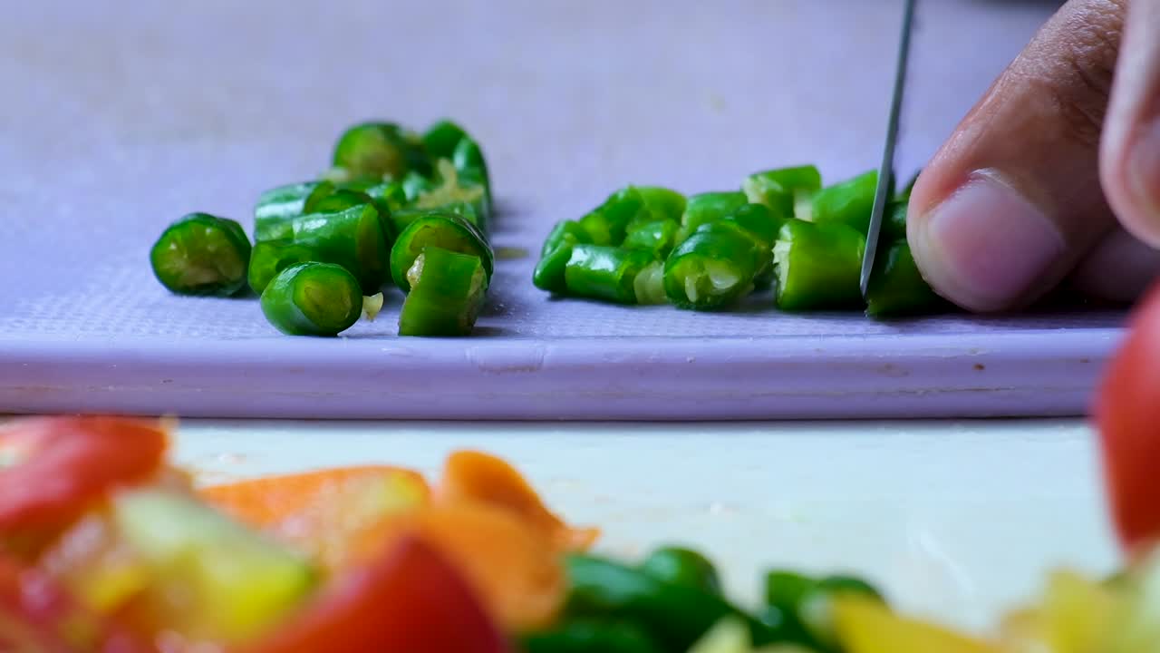 Zoom Out: Green Chili Pepper Chopped for a Salad Preparation