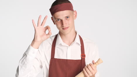 Baker-with-rolling-pin-giving-ok-gesture