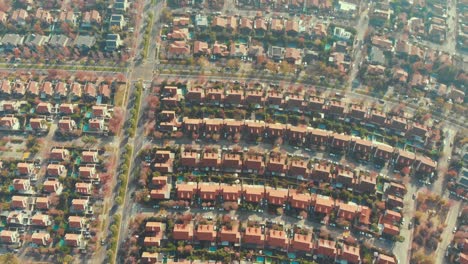 slowly ascending over house roofs on local neighborhood in santiago, chile-4k