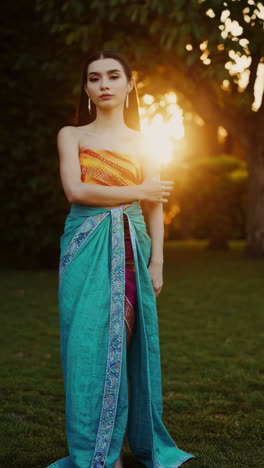 woman in traditional thai dress at sunset