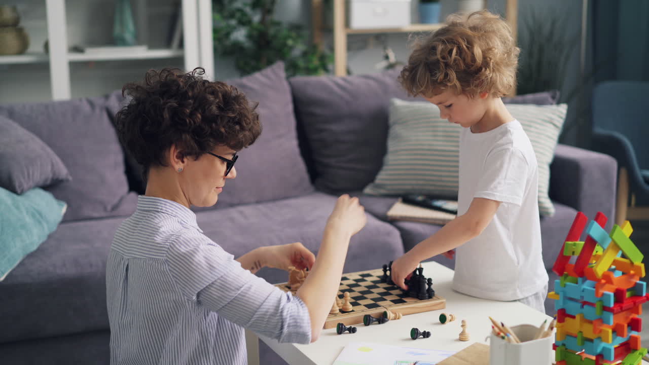 Mother and Son Playing Chess at Home