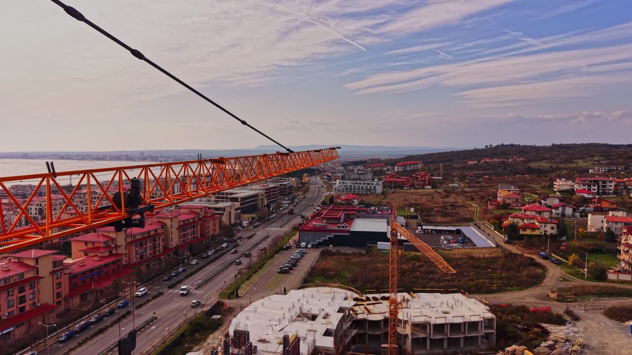 Construction crane overlooking a coastal town in Bulgaria
