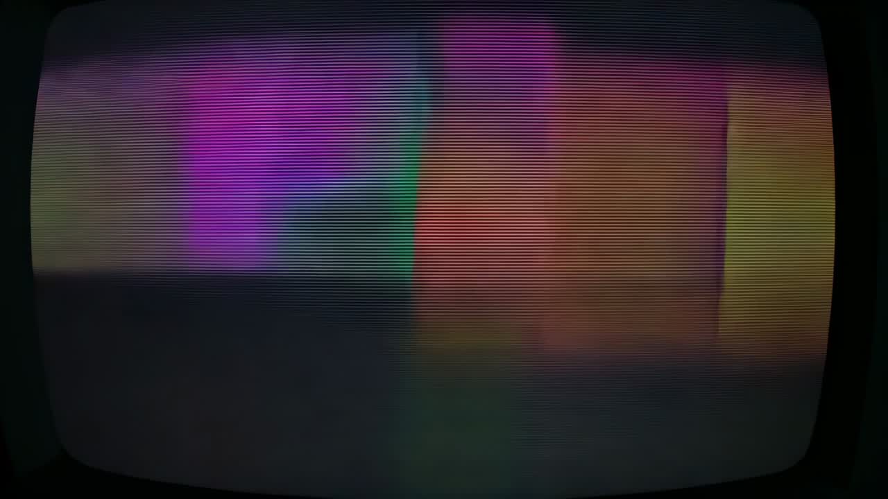 Booting CRT monitor displaying colored bars sliding horizontally in dark room, glitch artifacts