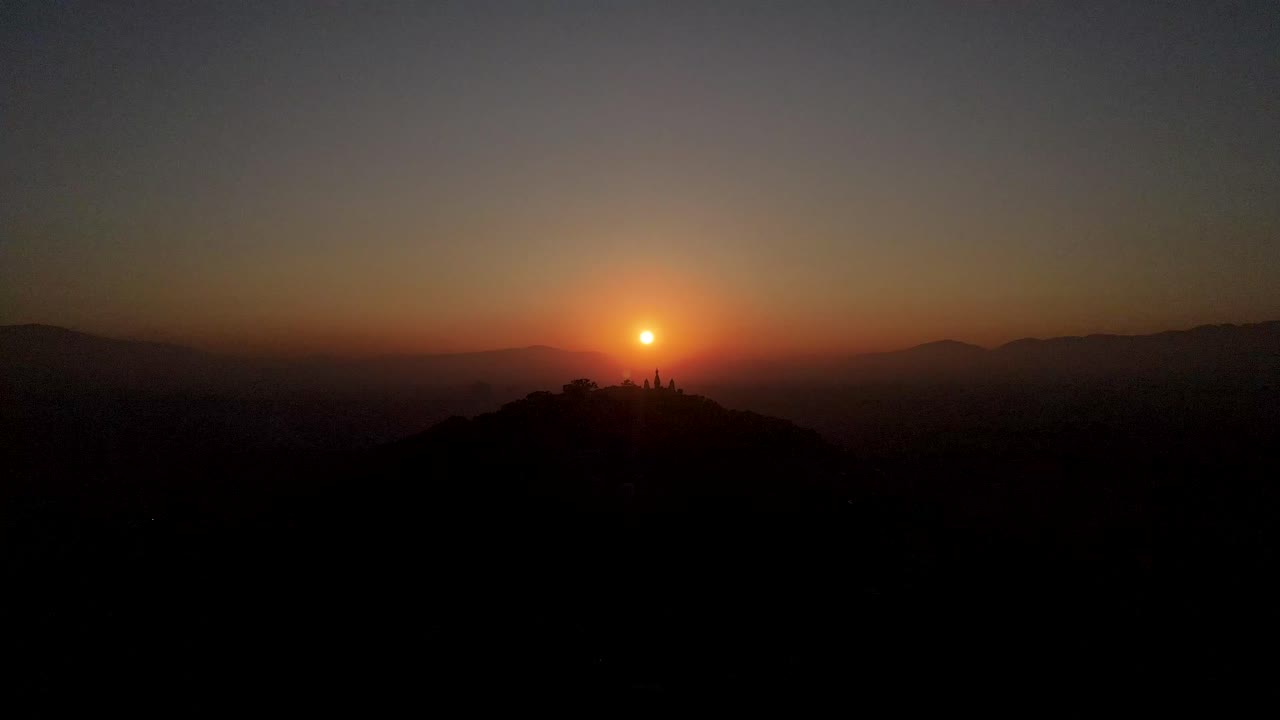 The aerial view shows a gloomy sunrise over the city of Kathmandu, Nepal