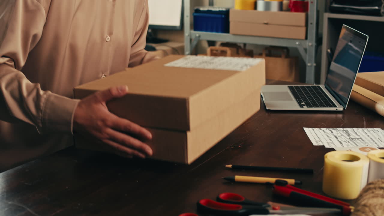 E-commerce storage shop, woman packing goods and clothes for second hand delivery market, dedicated Packaging and Shipping Workspace with Supplies and Technology for efficiency, online sales.