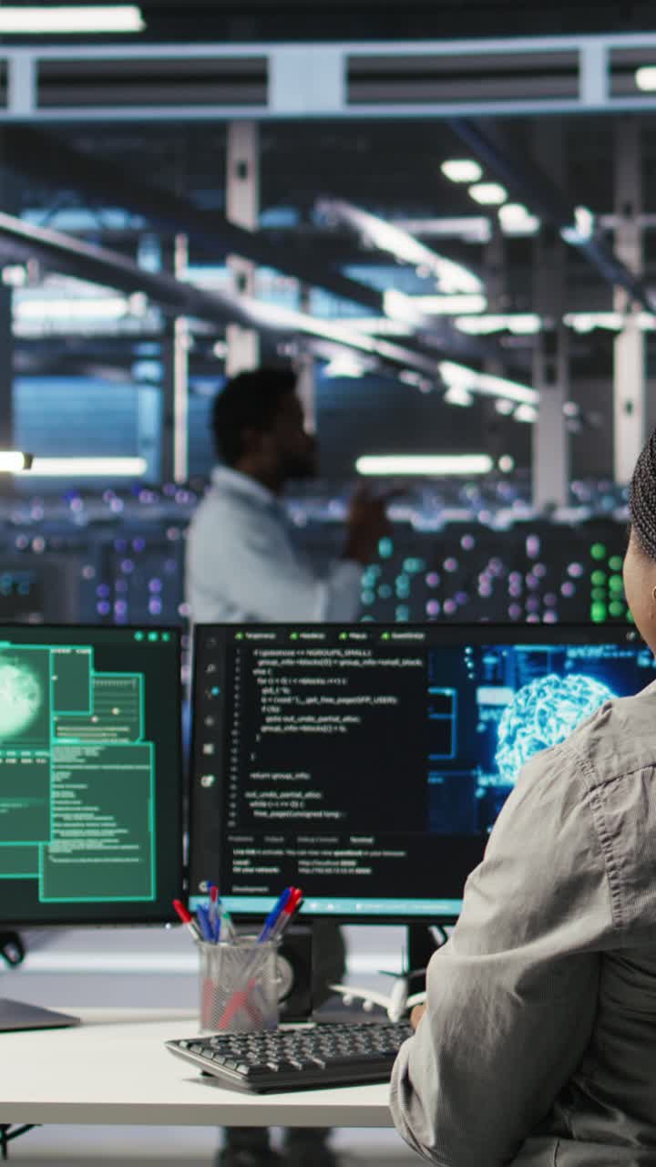 Vertical Video Server Farm It Expert Responds To Security Breach Alert Displayed On Pc Monitor