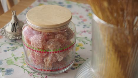 glass jar of candied fruit on a table