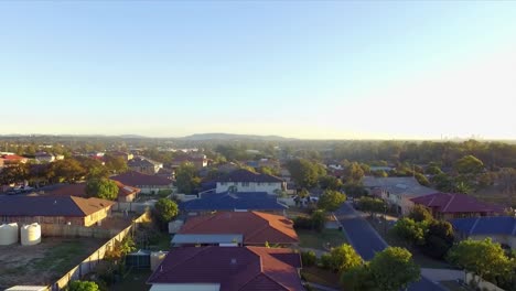 aerial drone slow descending shot over suburban neighborhood in brisbane