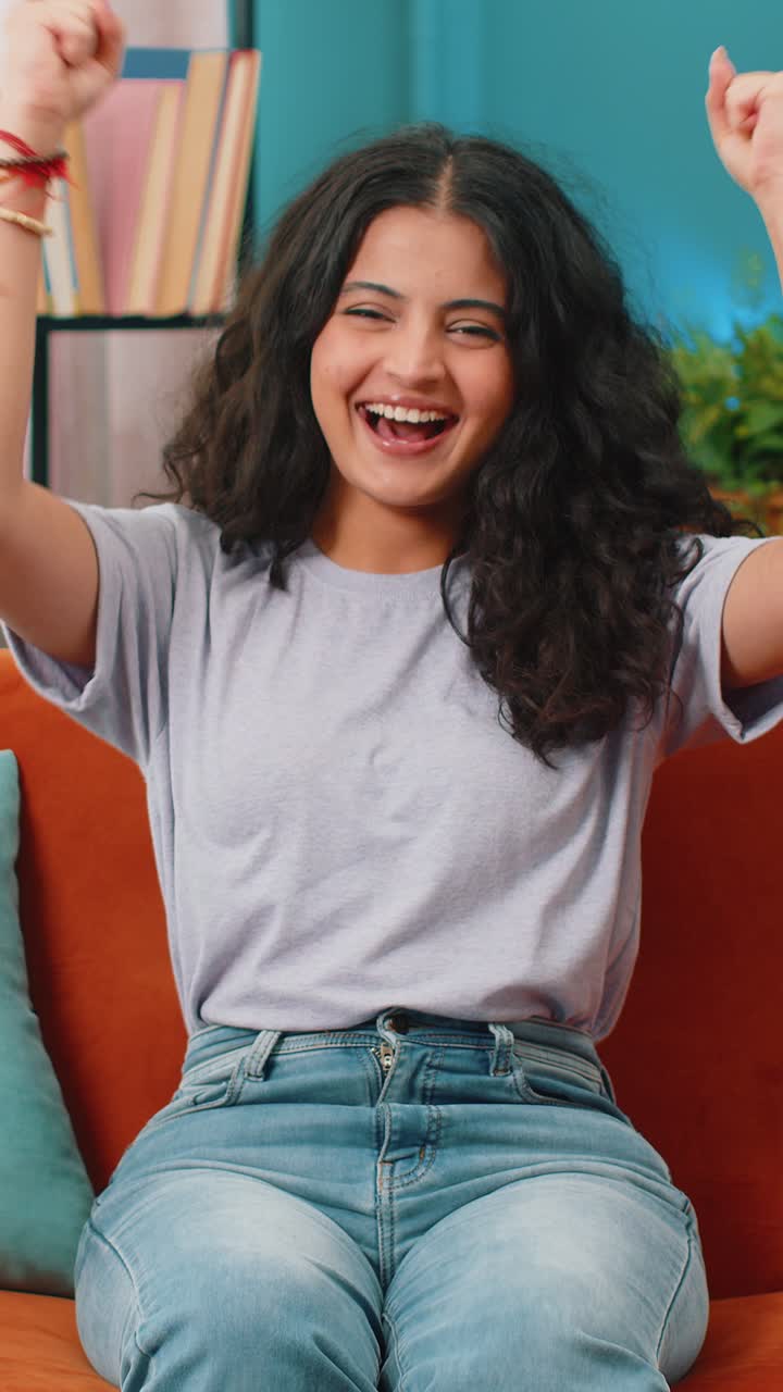 Excited happy indian woman surprised shocked by sudden victory good win news celebrate wow reaction