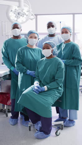 vertical video of portrait of diverse surgeons with face masks