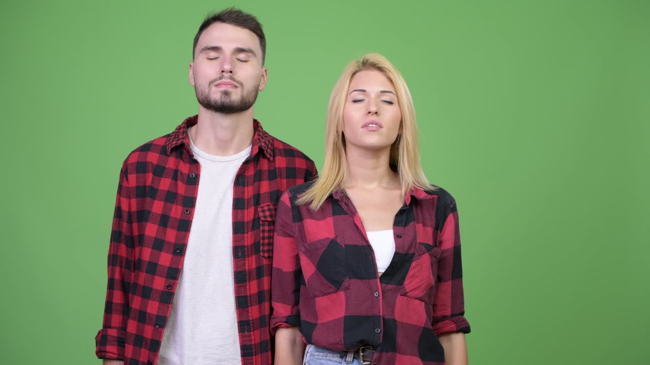 Young couple relaxing together with eyes closed