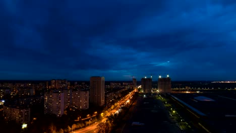 the night to day transition above the city. time lapse