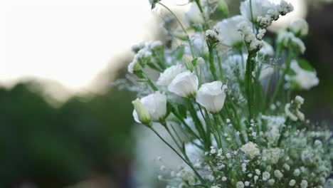 a bouquet of white flowers with baby's breath
