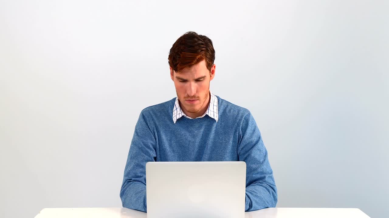 Man using laptop on table against white background 4k | Premium Stock ...