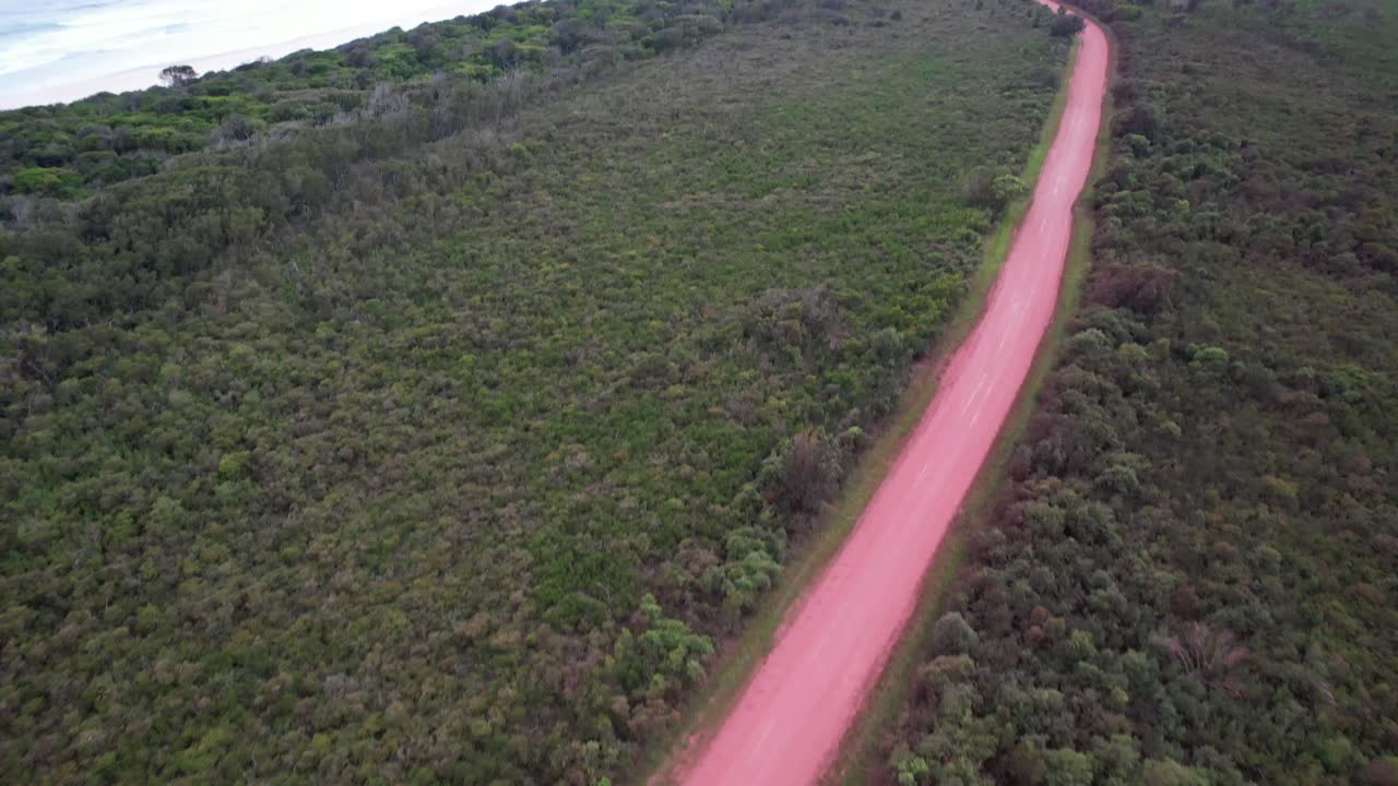 Diamond Head Road Through Forest Landscape On Barrington Coast In New South Wales, Australia. aerial tilt-up shot