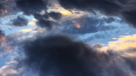 clouds moving in the blue sky, pov from top