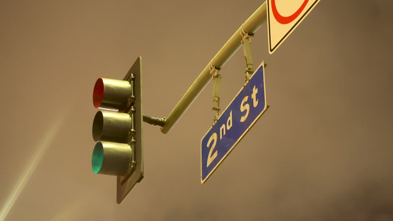 Traffic Light and Street Sign at Night