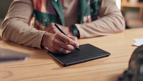 close up of a person using a graphic tablet