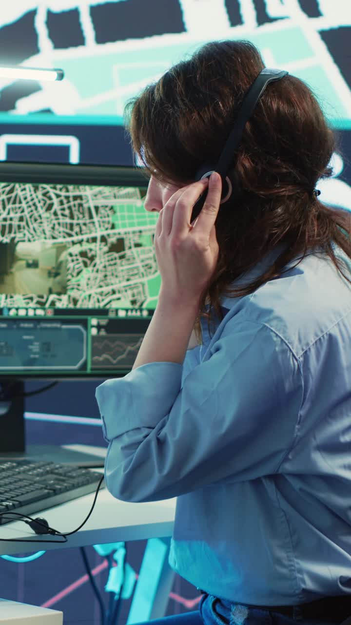 Focused Woman Puts on Headset and Works on Computer