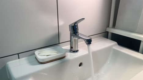 slowmotion of opening and closing the water tap in bathroom