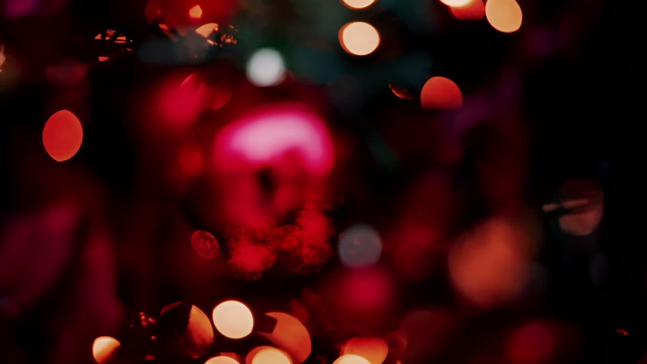 Close up of blurred Christmas decorations and lights on a tree