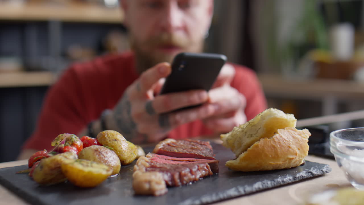 Food Blogger Taking Pictures of Steak with Phone