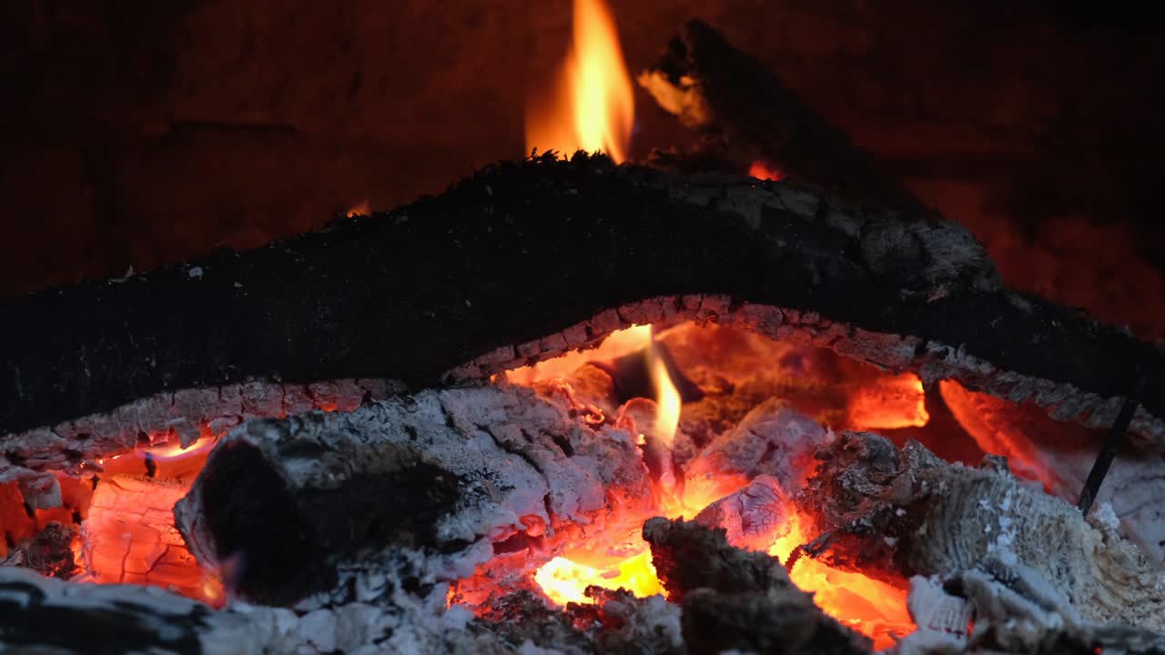 Fire is burning in the fireplace. Hearth. Warmth and home comfort. Flames of a country house. 4k