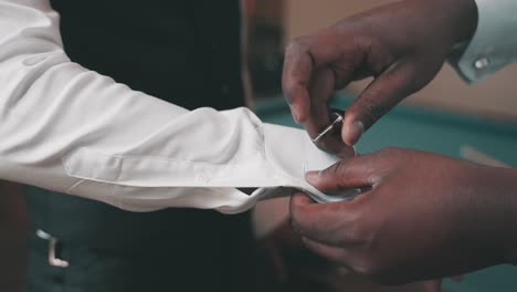 black-best-groomsmen-buttons-cufflinks-on-groom