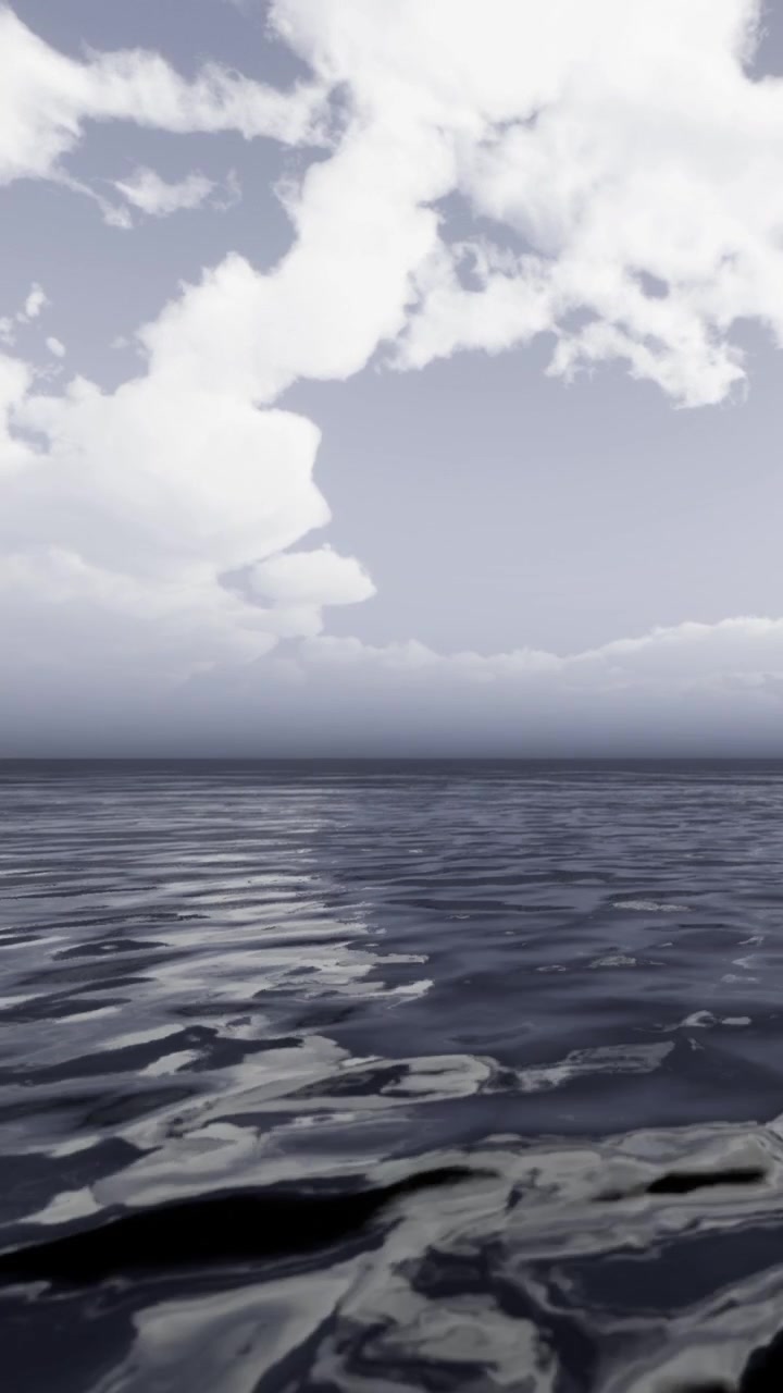 Clouds gather over water during late afternoon