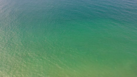 aerial view the emerald green waters of the andaman sea.