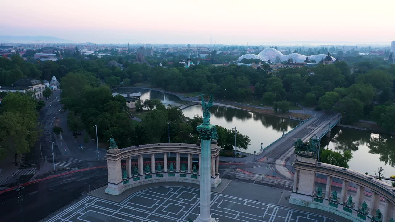 Drone footage of the empty Heroe's Square in Budapest, Hungary at the time of the Covid virus. Early morning at the sunrise in spring.Drone circles right.