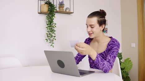 Person using laptop and credit card