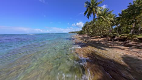 fpv shot of tropical beach portillo in las terrenas, samana peninsula, dominican republic