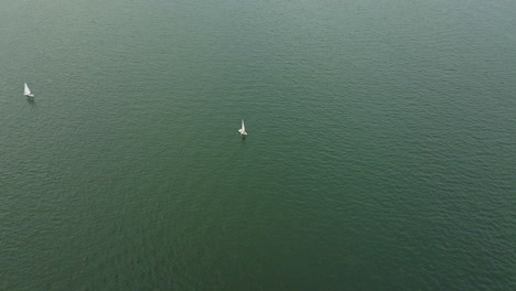 aerial drone shot of sailing tourism boat on the water in hong kong, china