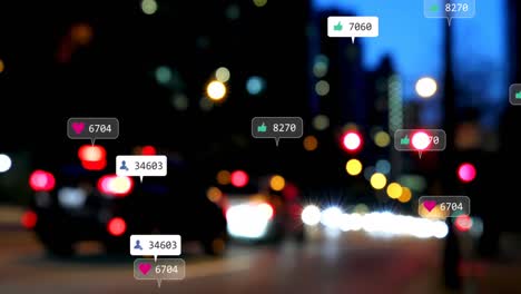 Animation-of-social-media-icons-and-numbers-over-out-of-focus-city-lights