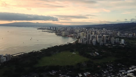 aerial view approaching waikiki beach in honolulu, hawaii during sunset