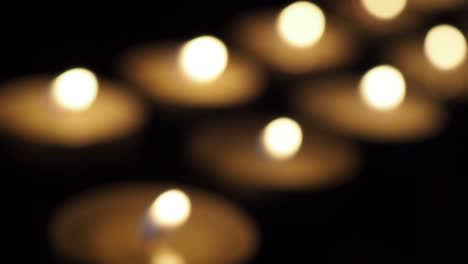 candles in the dark out of focus close-up