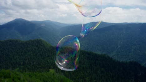 soap bubbles over mountain landscape