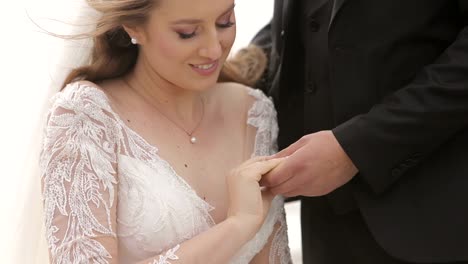Close-up of Bride and Groom Holding Hands
