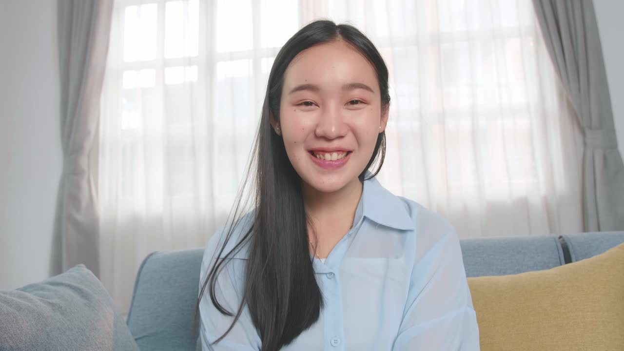 Asian Woman Talking To Camera In Home Living Room, Video In 4K