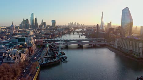 establishing aerial drone dolly forward shot of thames river london city centre sunrise